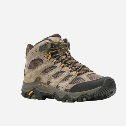 Brown hiking boot with black sole on a white background