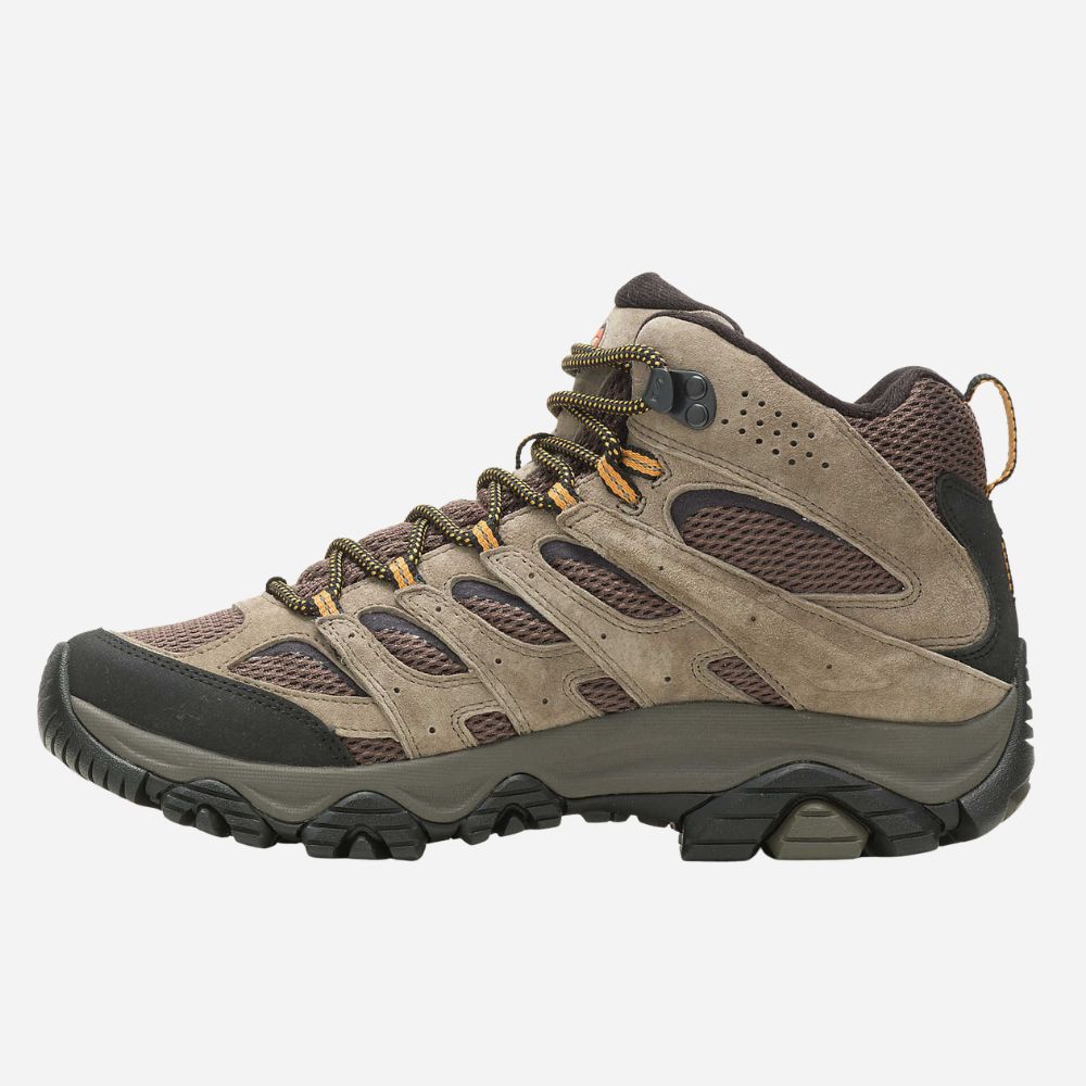 Brown hiking boot with black sole on a white background