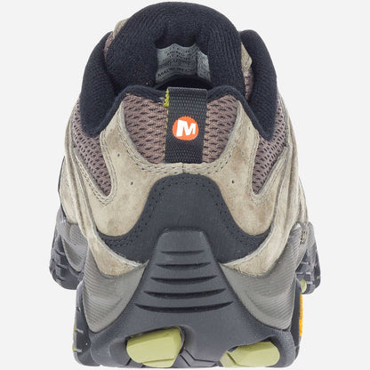 Close-up of a hiking shoe with a brand logo on a white background