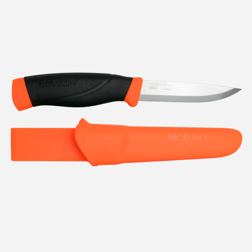 Knife with orange sheath and black handle on a white background