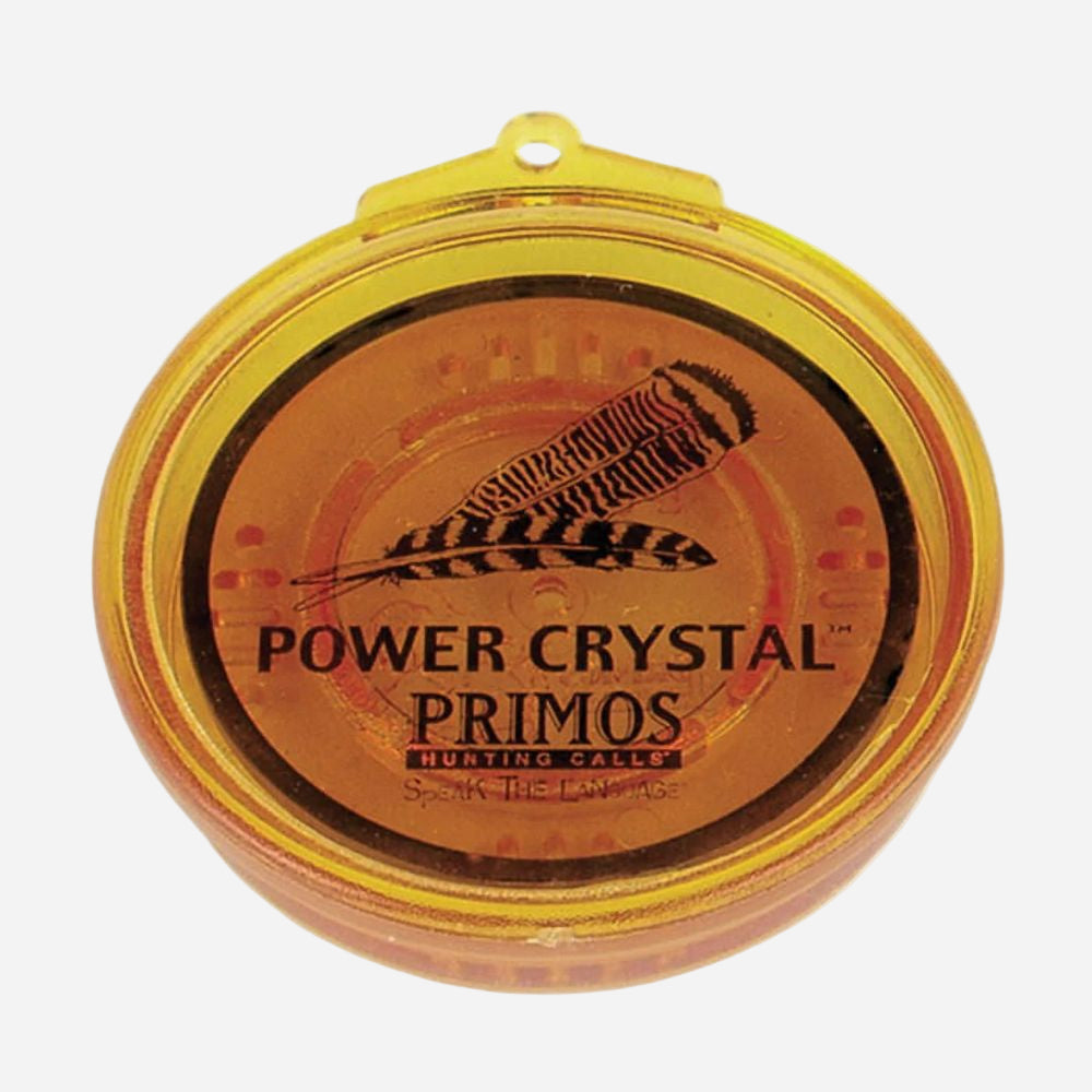 Power Crystal Primos hunting call with feather design on a white background