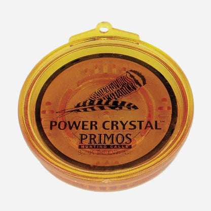 Power Crystal Primos hunting call with feather design on a white background