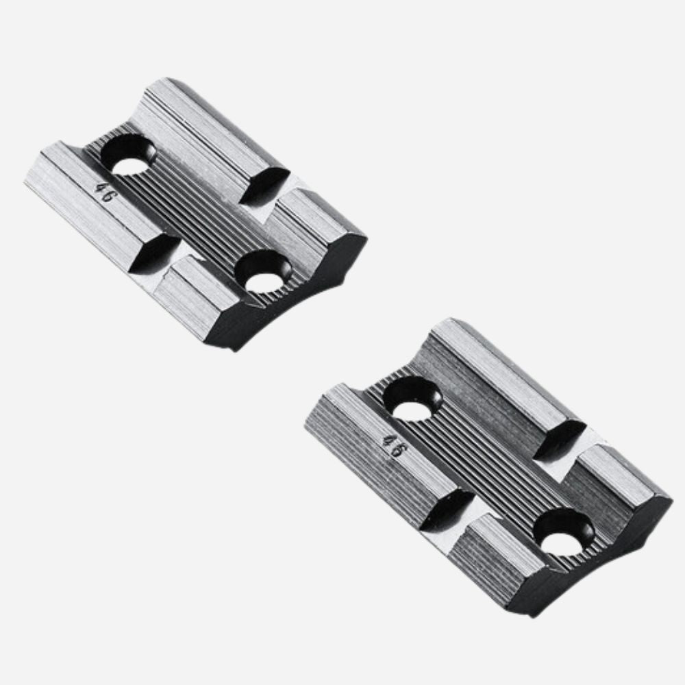 Two metallic slide components on a white background