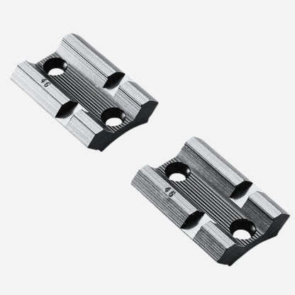 Two metallic slide components on a white background