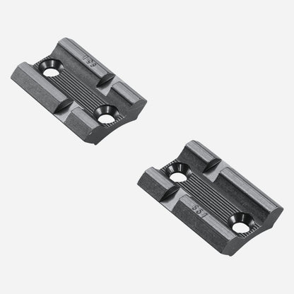 Two black metal brackets on a white background