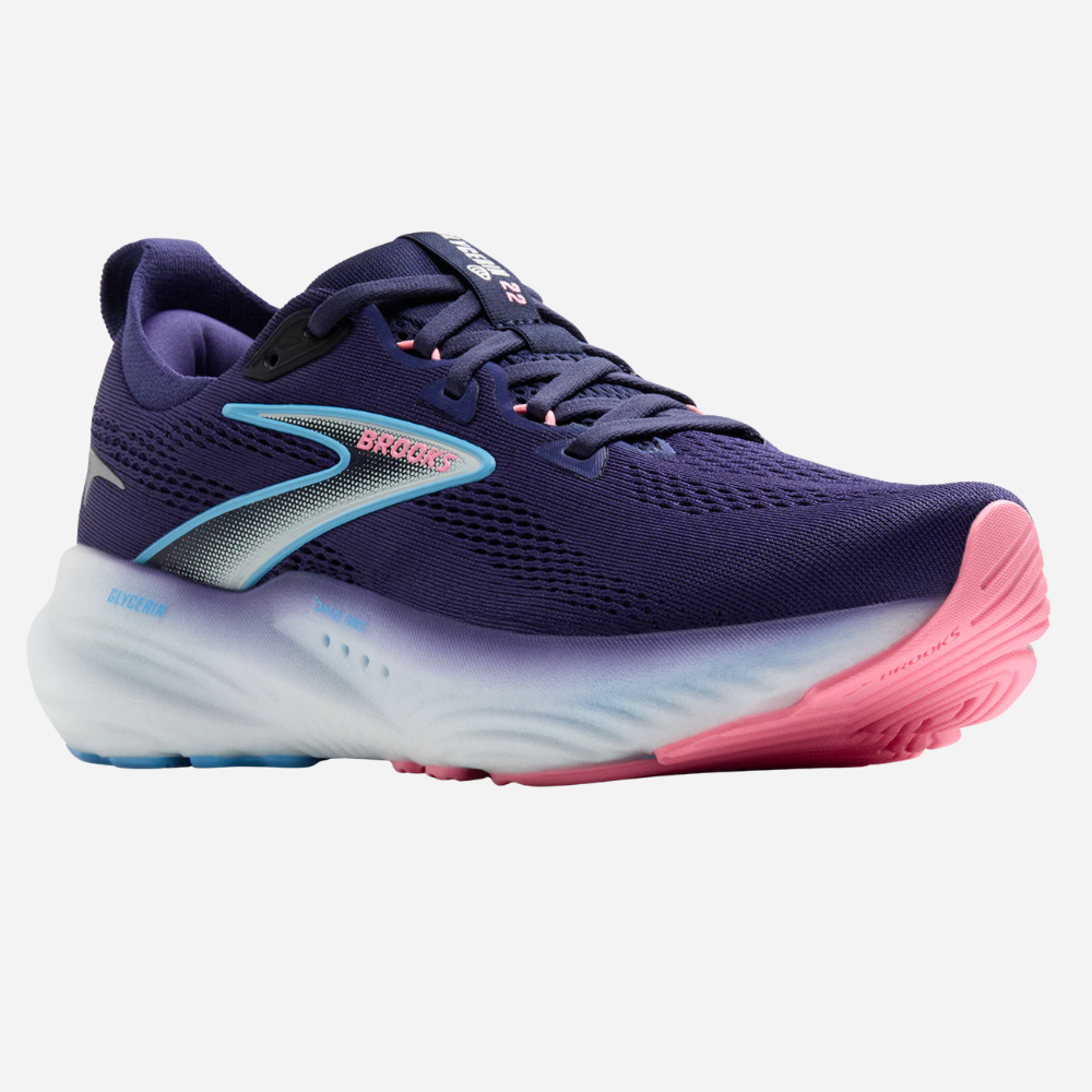 Purple running shoe with pink sole on a white background