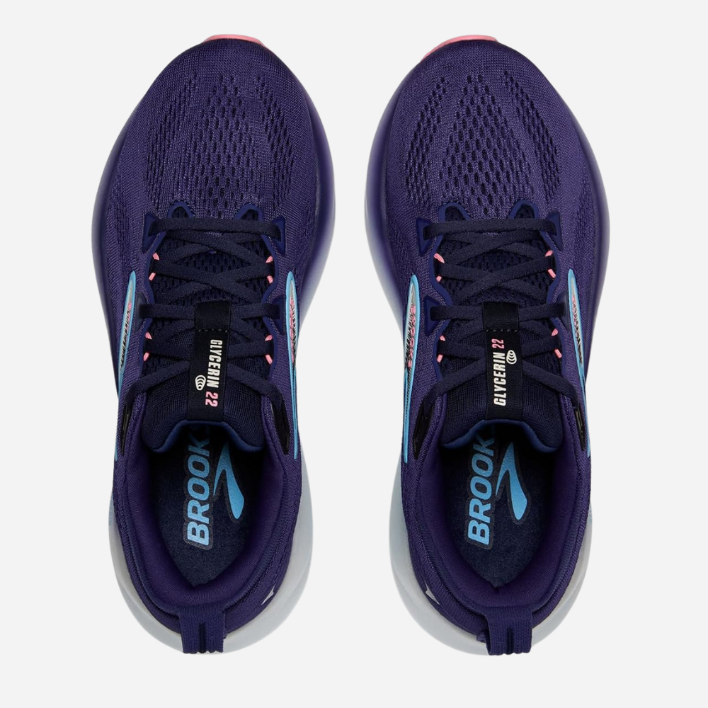 Pair of purple running shoes with 'Brook' branding on a white background