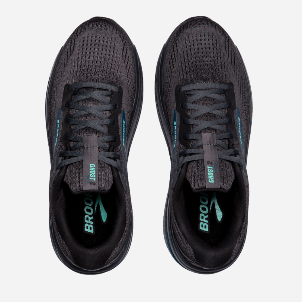 Pair of black running shoes with visible 'Brooks' branding on a light gray background