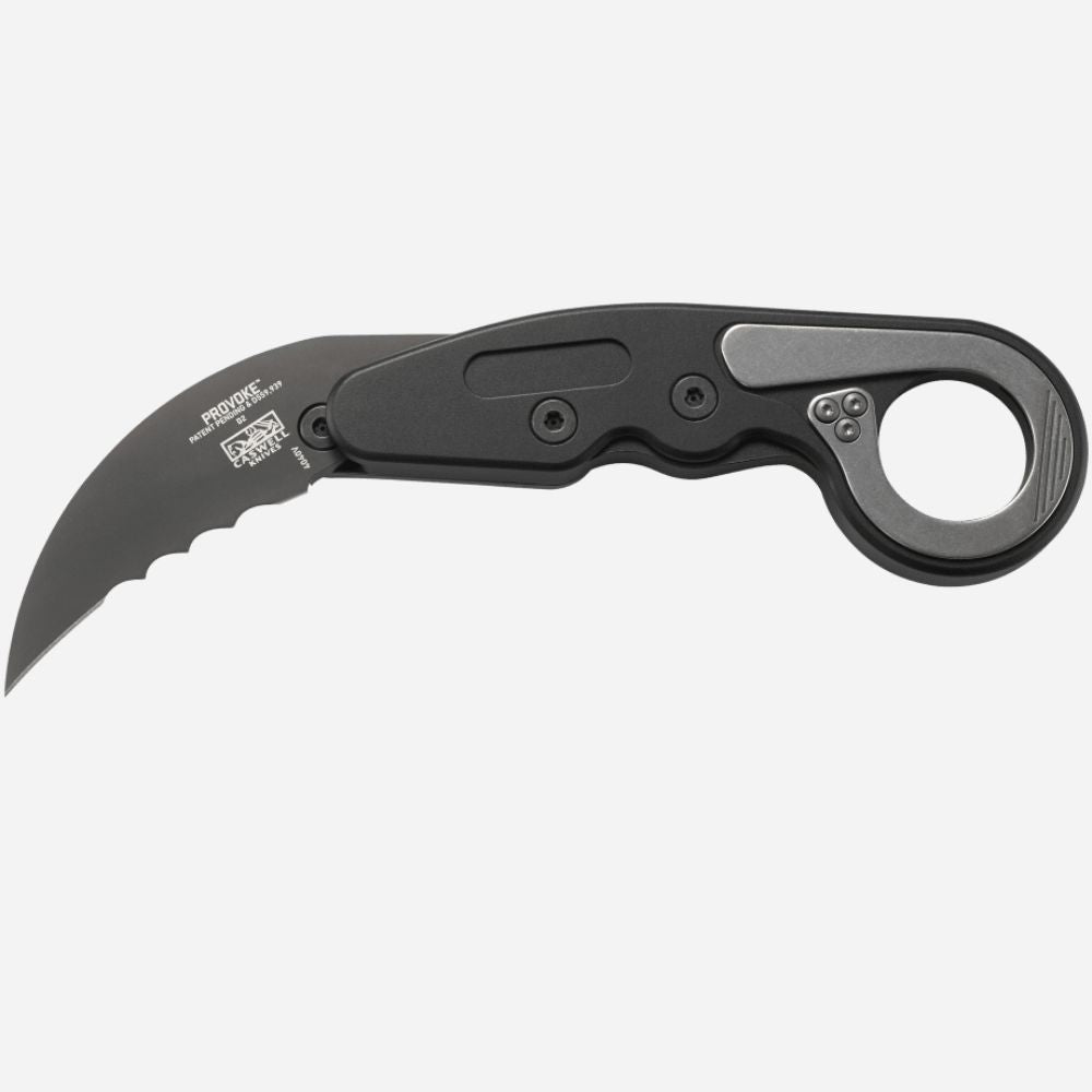 Black folding knife with a karambit blade on a white background