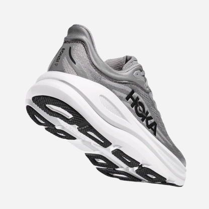 Gray running shoe with white sole on a white background