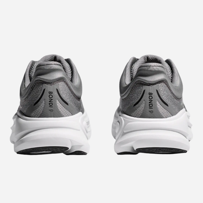 Gray running shoes with white soles on a light gray background