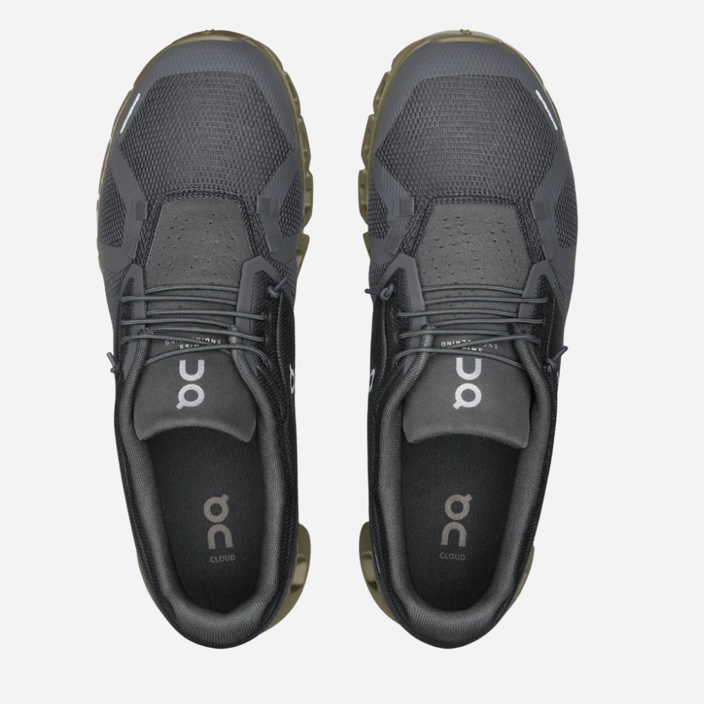 Pair of black athletic shoes with 'on' branding on a white background