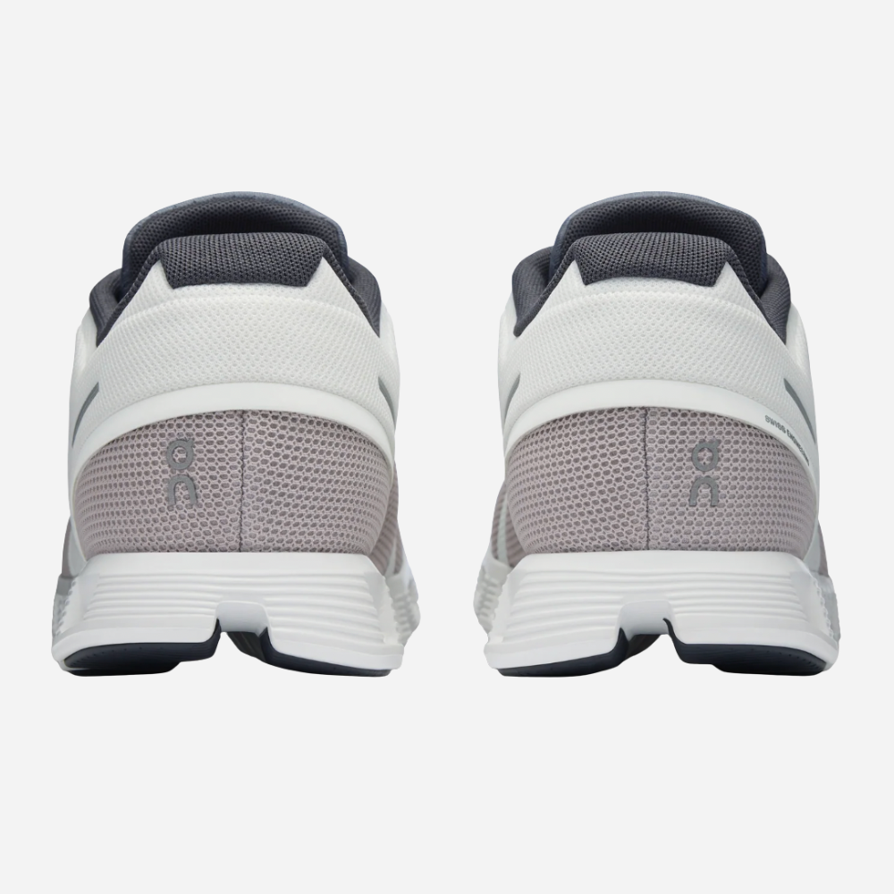 White and gray athletic shoes with a visible brand logo on a white background