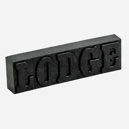 Black rectangular block with 'LODGE' text on a white background