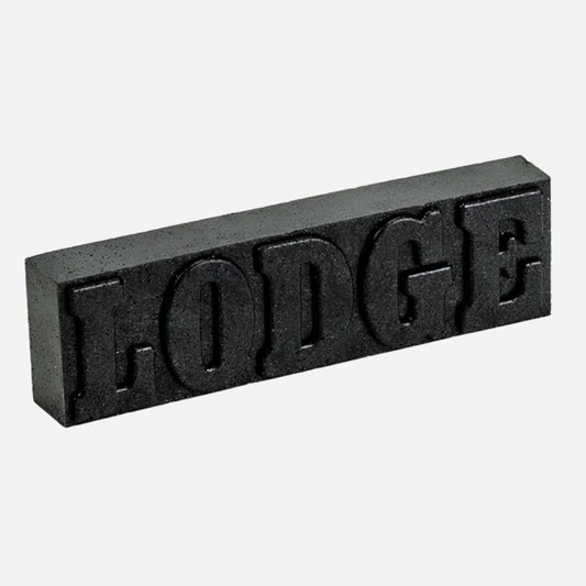 Black rectangular block with 'LODGE' text on a white background